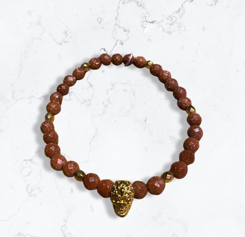 Goudsteen met skull
