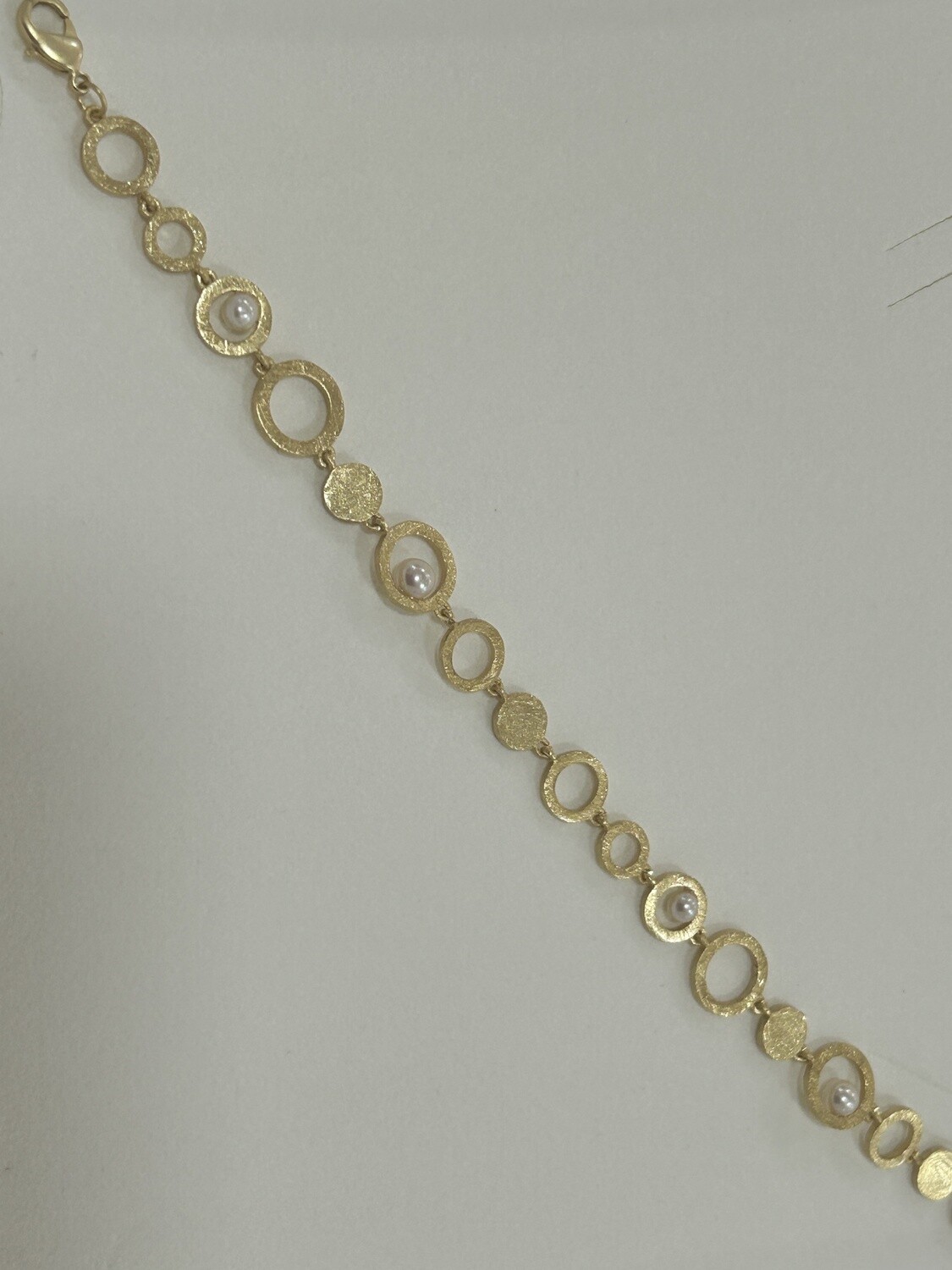Armband goud plaque cirkels + parels
