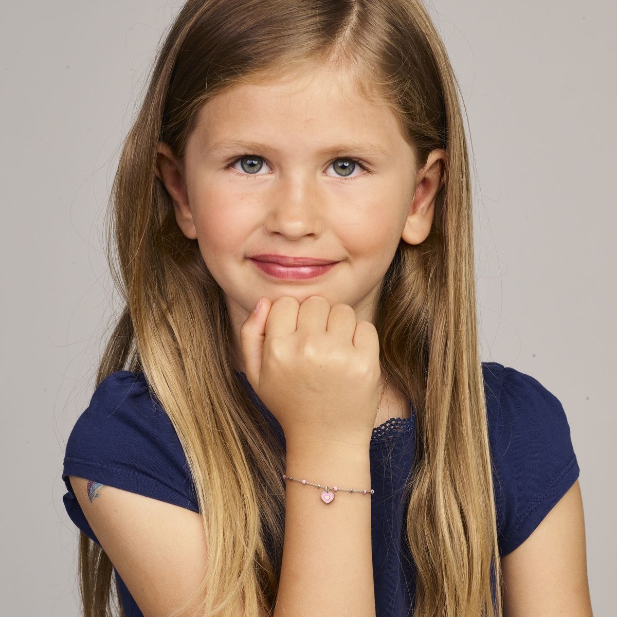 Kinderarmband met roze hart en bolletjes