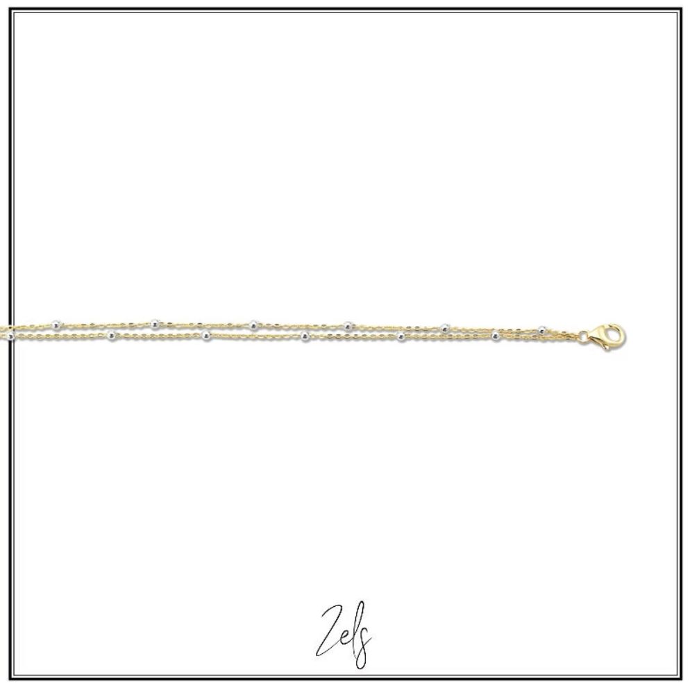 Fijn dubbel armbandje met subtiele bolletjes, perfect om dagelijks te dragen als subtiele toets