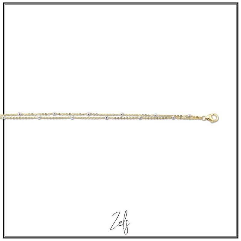 Fijn dubbel armbandje met subtiele bolletjes, perfect om dagelijks te dragen als subtiele toets