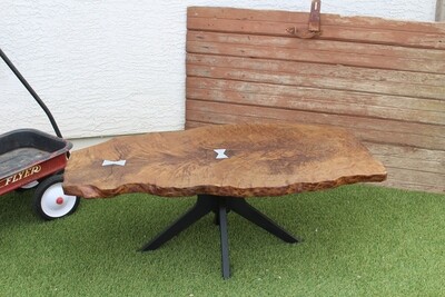 Redwood coffee table with silver bowtie inserts