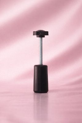 Hand held collar pump perfume bottle capping tool.