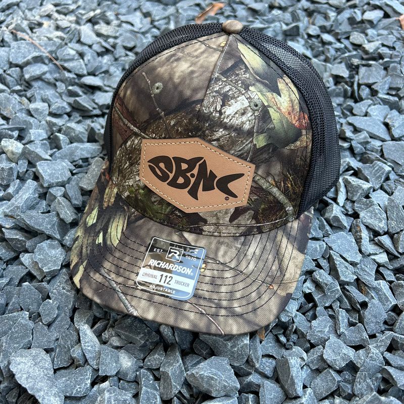 SBNC FISH HEX PATCH CAP MOSSY OAK COUNTRY DNA CAMO/BLK 112