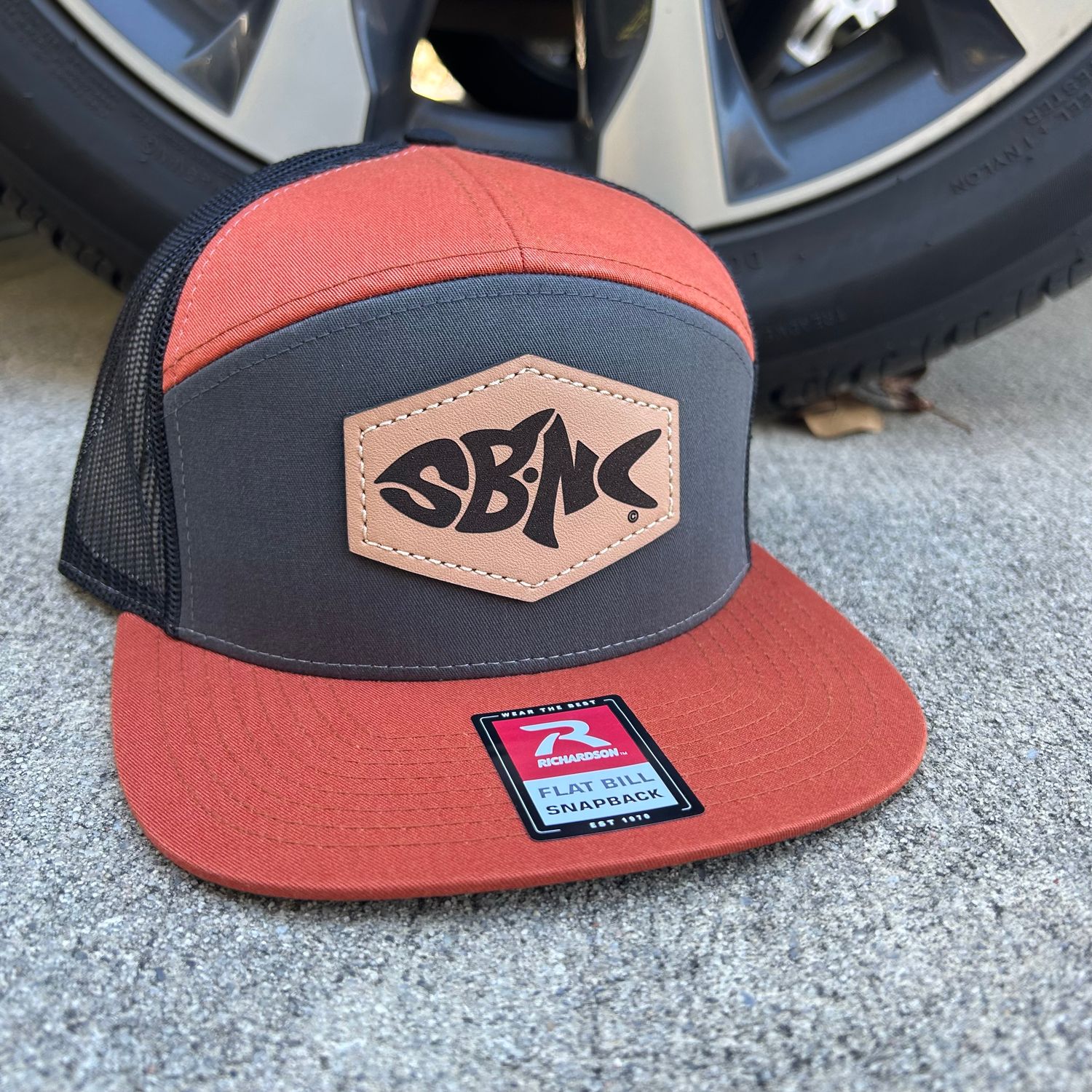SBNC FISH HEX PATCH 7-PANEL CAP CHAR/BRNTORNG/BLK 168