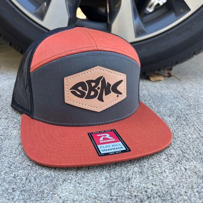 SBNC FISH HEX PATCH 7-PANEL CAP CHAR/BRNTORNG/BLK 168 SBNC FISH HEX PATCH 7-PANEL CAP CHAR/BRNTORNG/BLK 168