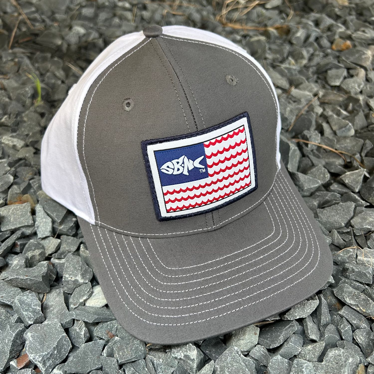 CAP SBNC FISH WAVES FLAG PATCH TWILL CHAR/WHITE 312