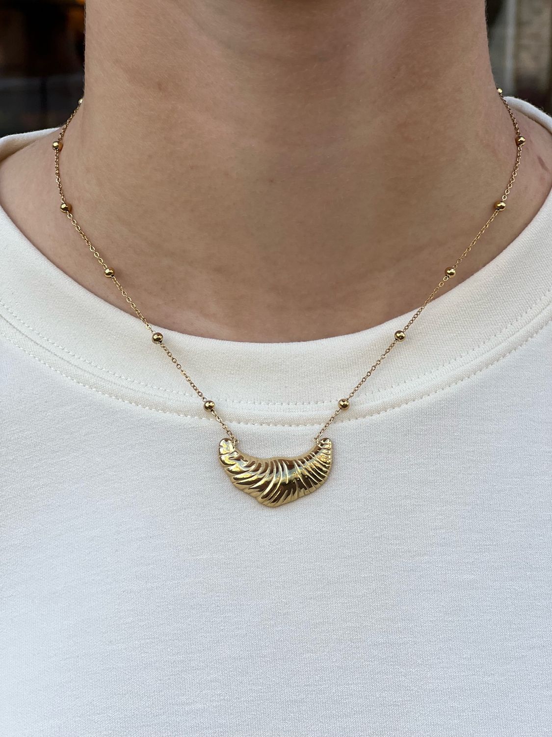 Ketting met croissant bedel 7