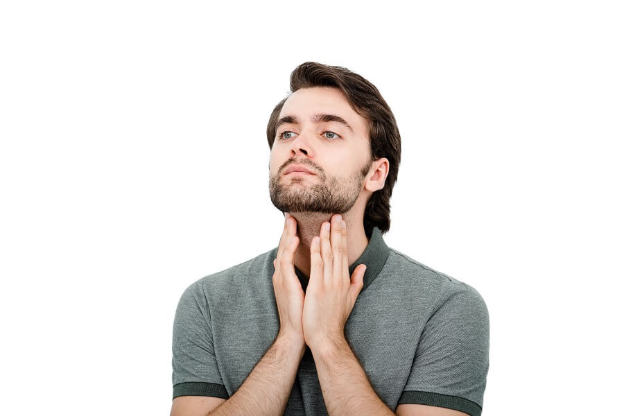 Man Examines His Thyroid Gland