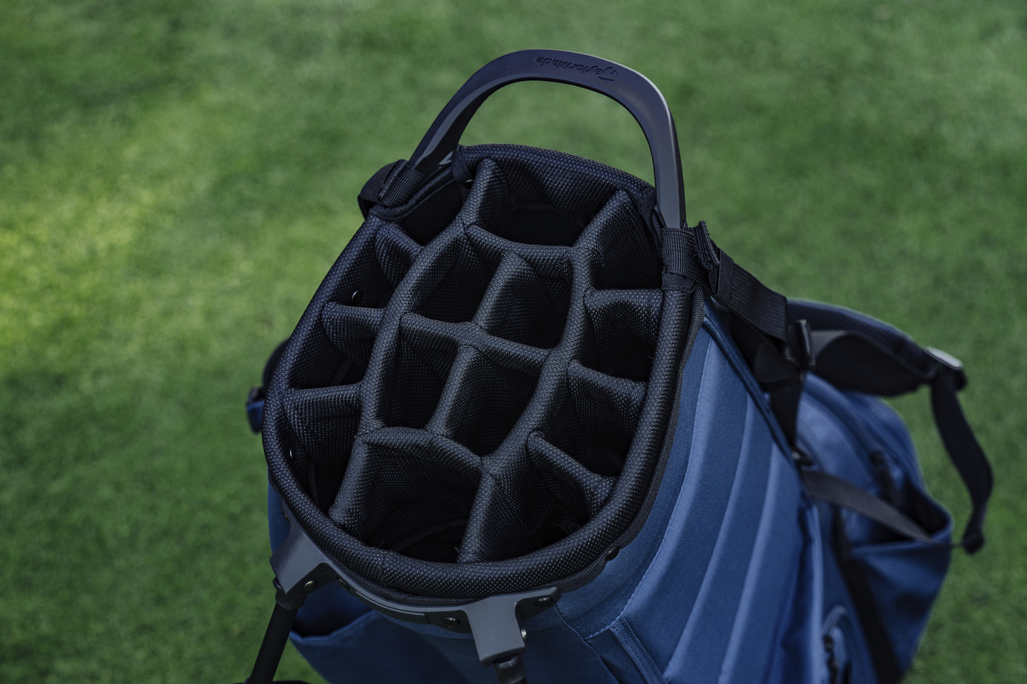 Golf bag dividers, showcasing multiple compartments to organize clubs and accessories, preventing damage and making it easy to access equipment during play