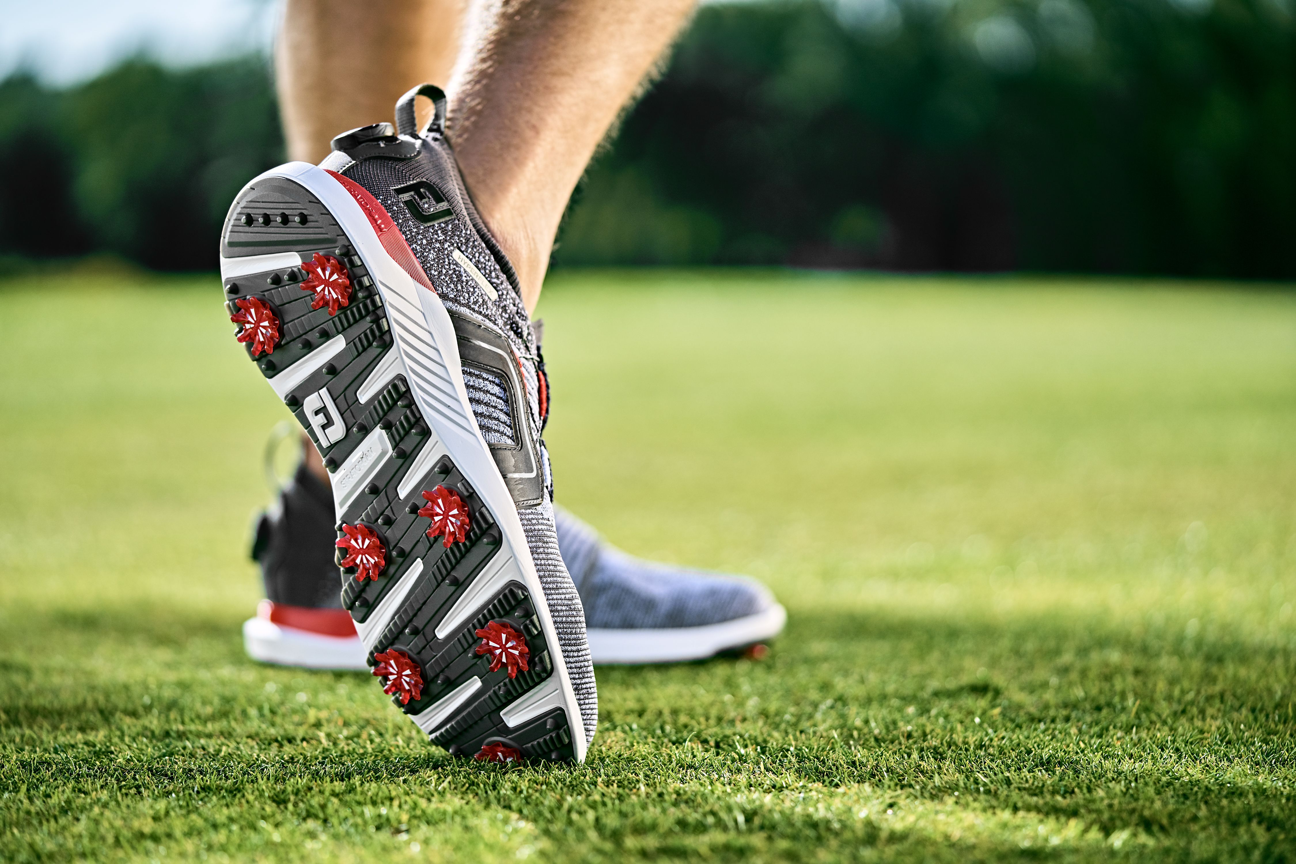 Spiked golf shoes featuring durable cleats for superior grip and stability, enhancing traction and control on various surfaces for improved performance on the course
