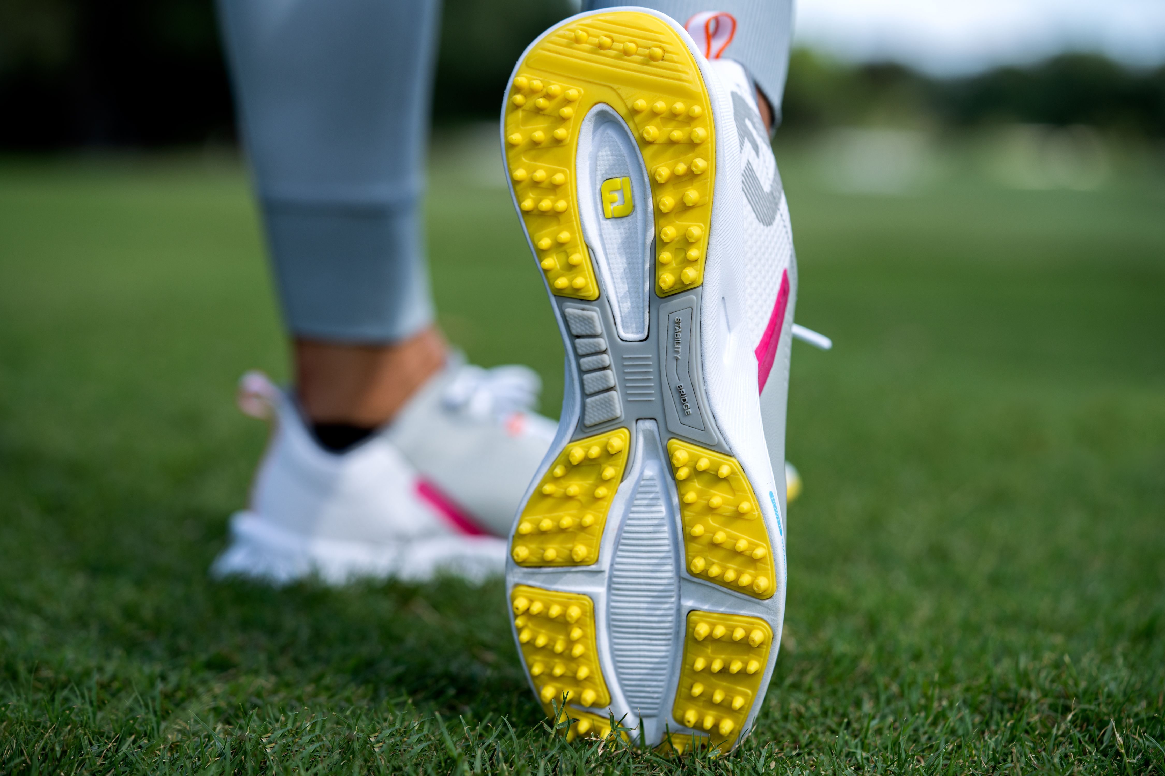 Spikeless golf shoes featuring durable cleats for superior grip and stability, enhancing traction and control on various surfaces for improved performance on the course