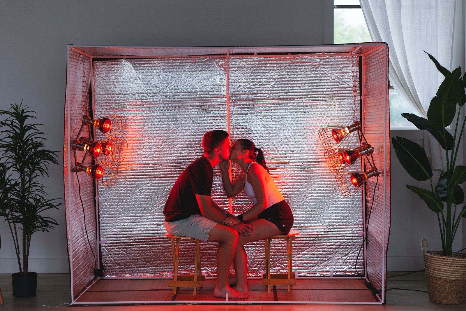 Couple enjoying a session inside the Sauna Fix near infrared sauna tent