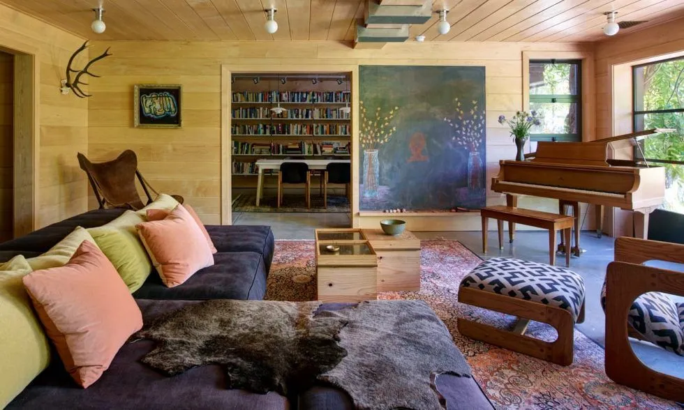 A living room filled with furniture and a piano.
