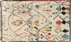 A white rug with a colorful pattern on it.