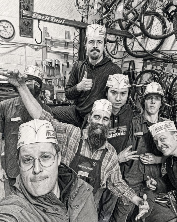 Recycled Cycles crew in the workshop wearing Krispy Kreme hats