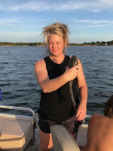 Woman holding a Catfish