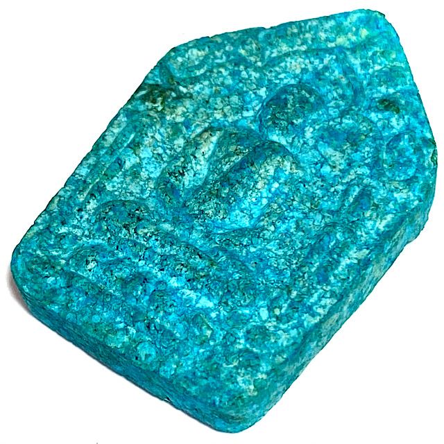 Front face of the amulet taken from above with the amulet laid down flat at a 45 degree angle of the front face of the amulet