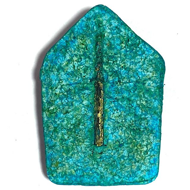 Rear face of the amulet full frontal view revealing the large Takrut Maha Bpraab Spell inserted into the sacred clay on the rear face