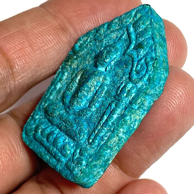 Amulet scene from the edge held in the hand showing the front face
