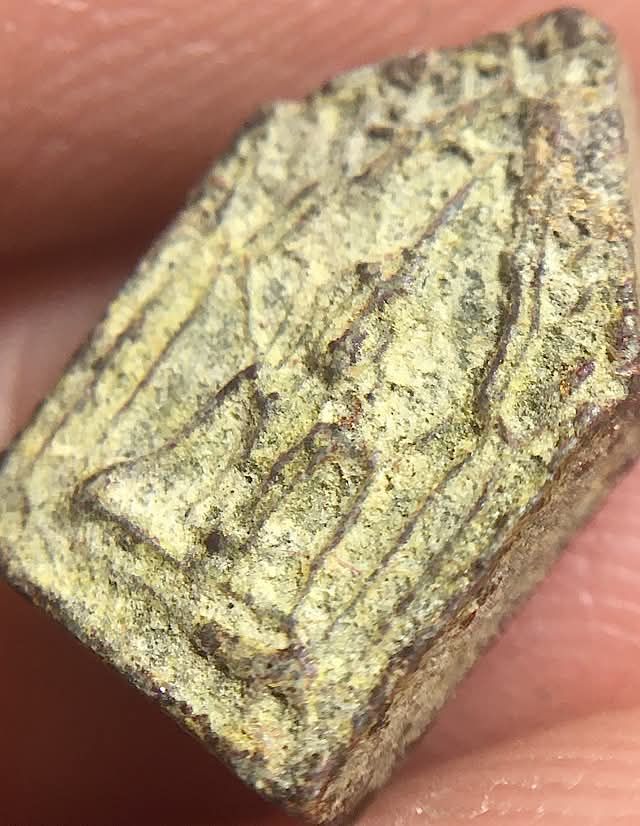 angled front side lateral view of Pra Khun Phaen amulet of Luang Phu Gaew Wat Laharn Rai
