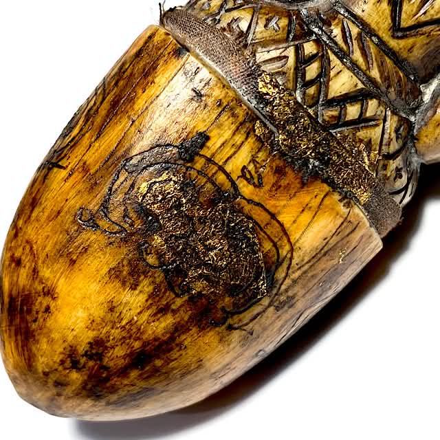 Pra Pikanes Nga Gae LP Derm Puttasar of Wat Nong Po close up of tip of tusk with hand inscription of Yant Putsoorn