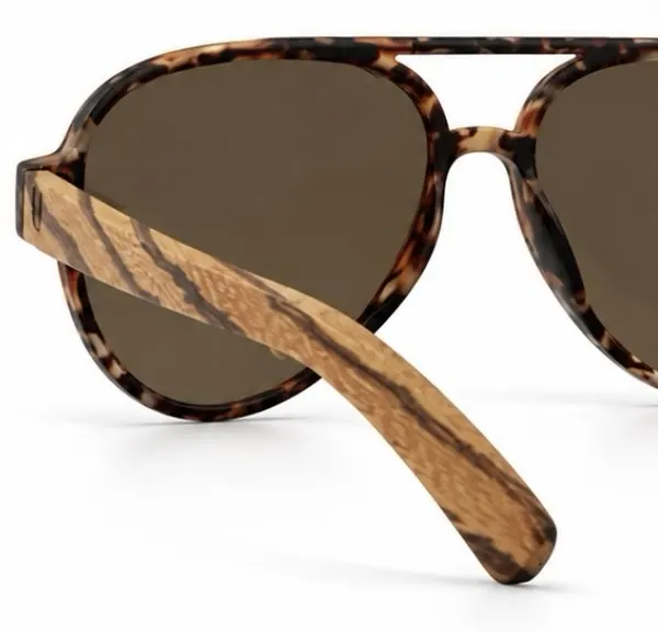 Close-up of RBIA sunglasses with gold lenses