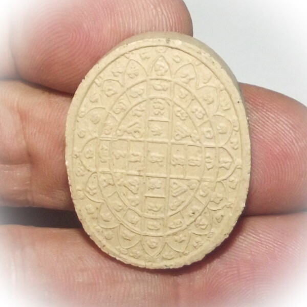 Healing Yantra onn rear face of Jivaka Rishi Healing Amulet in sacred powders by Luang Por Glom of Wat Nong Bua