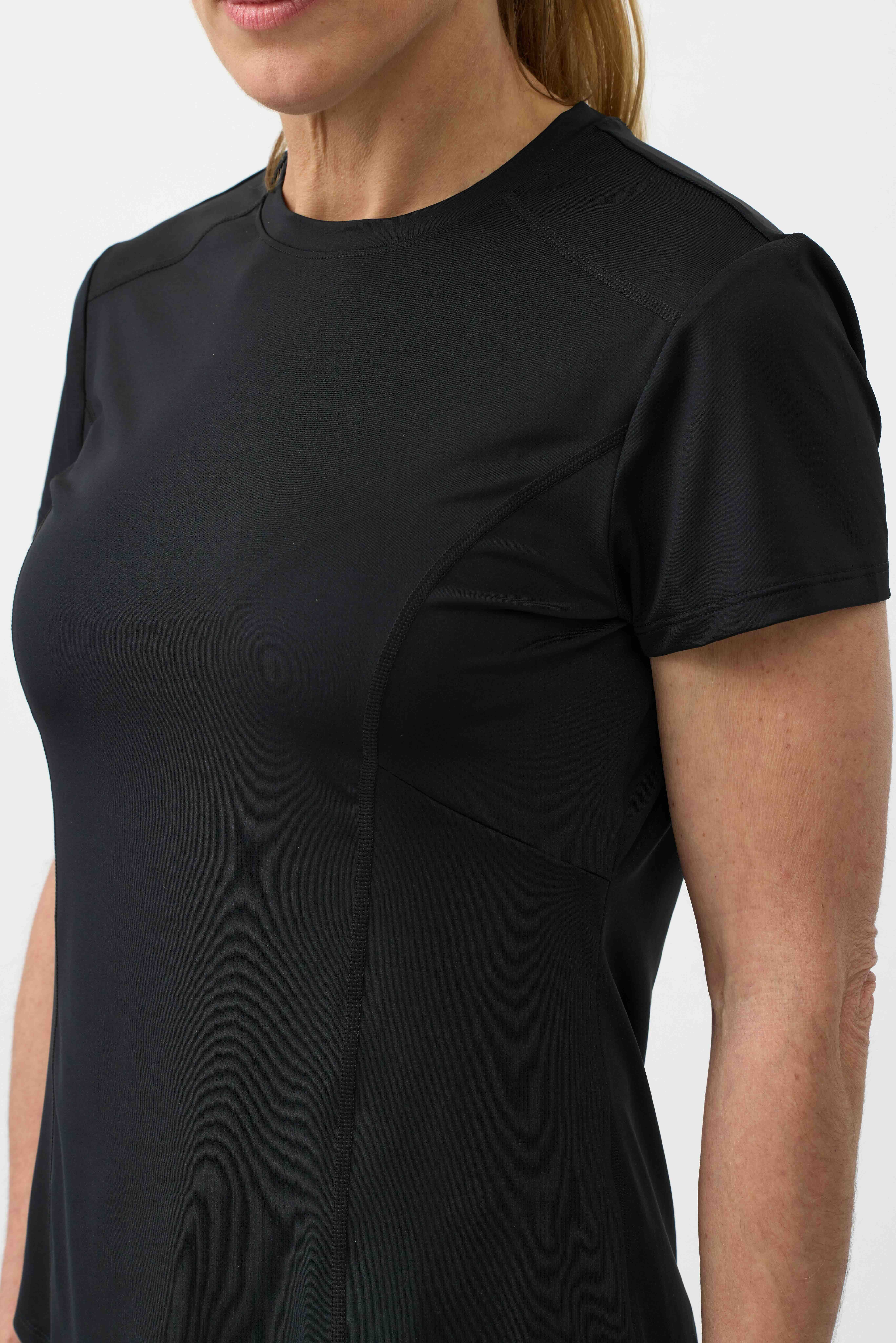 Black colour timeless style top on lady showing fabric close up 