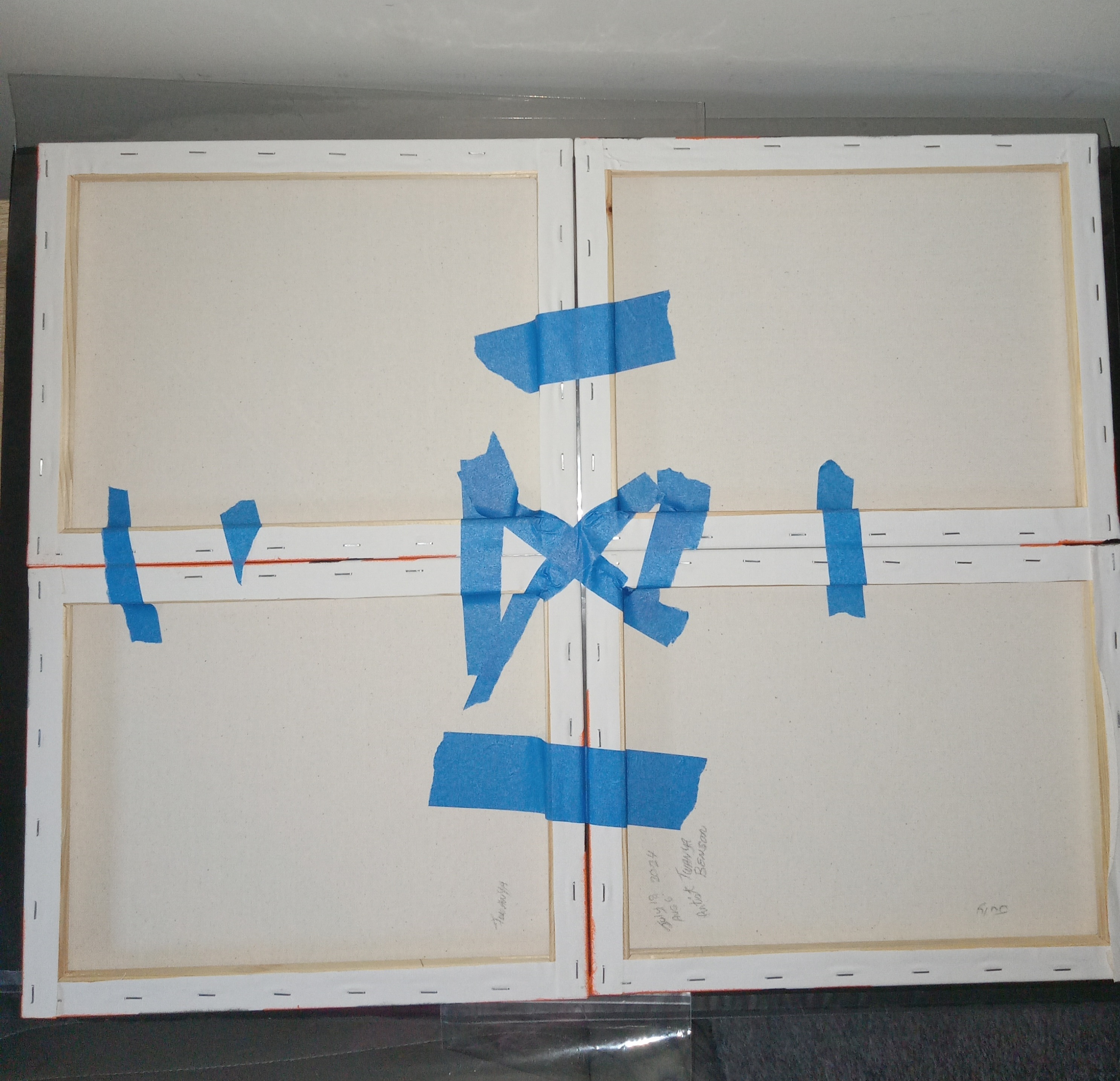 Taped the four canvases from the back ( used nonstick kind)